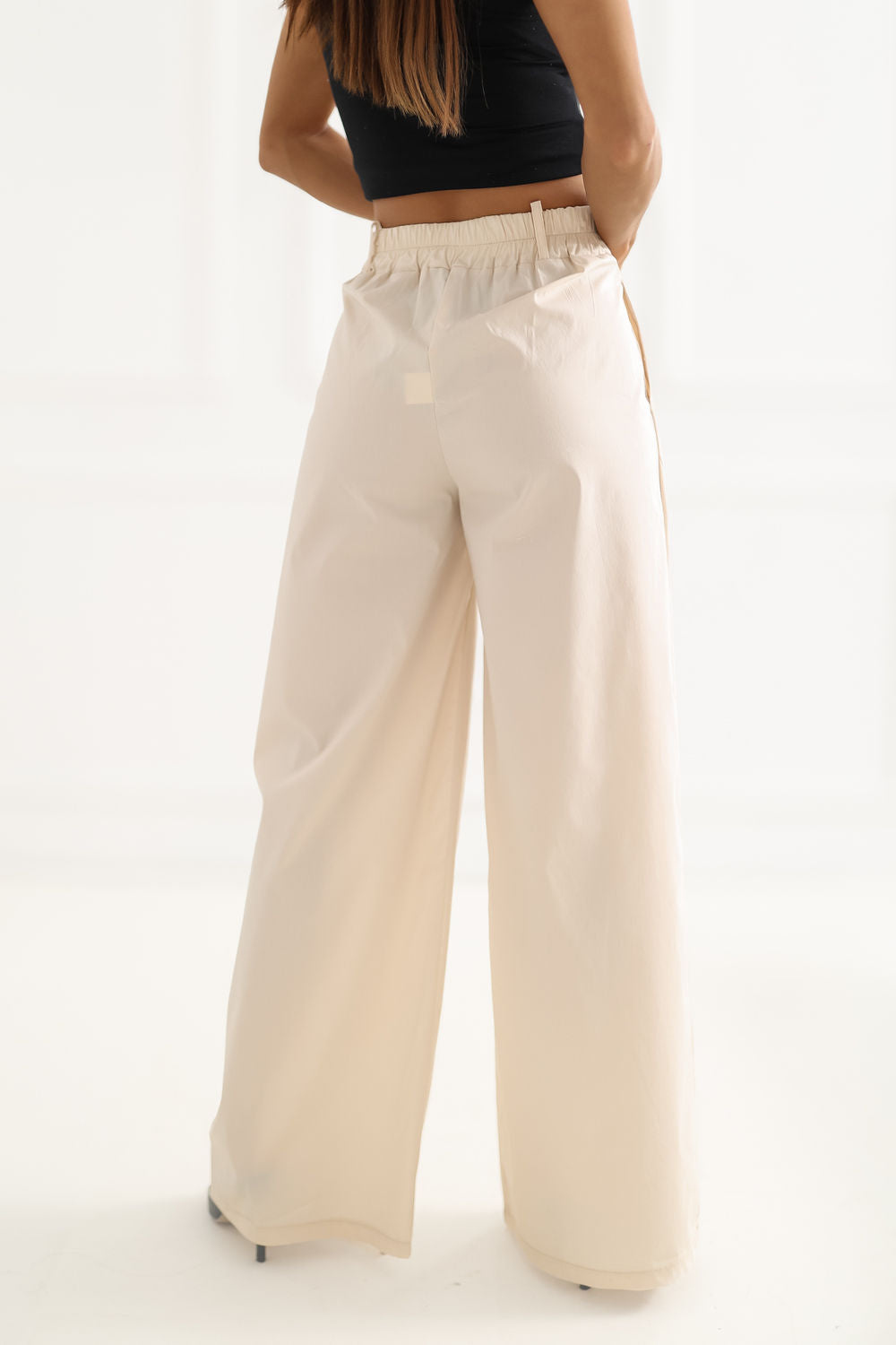 Green pleated trousers