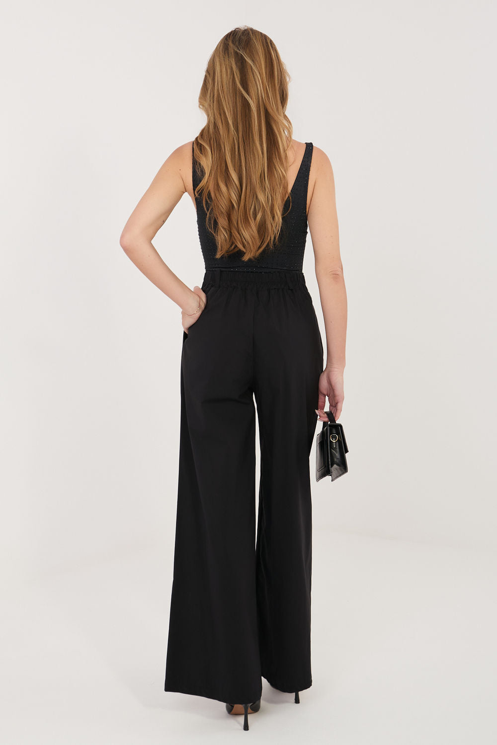 Green pleated trousers