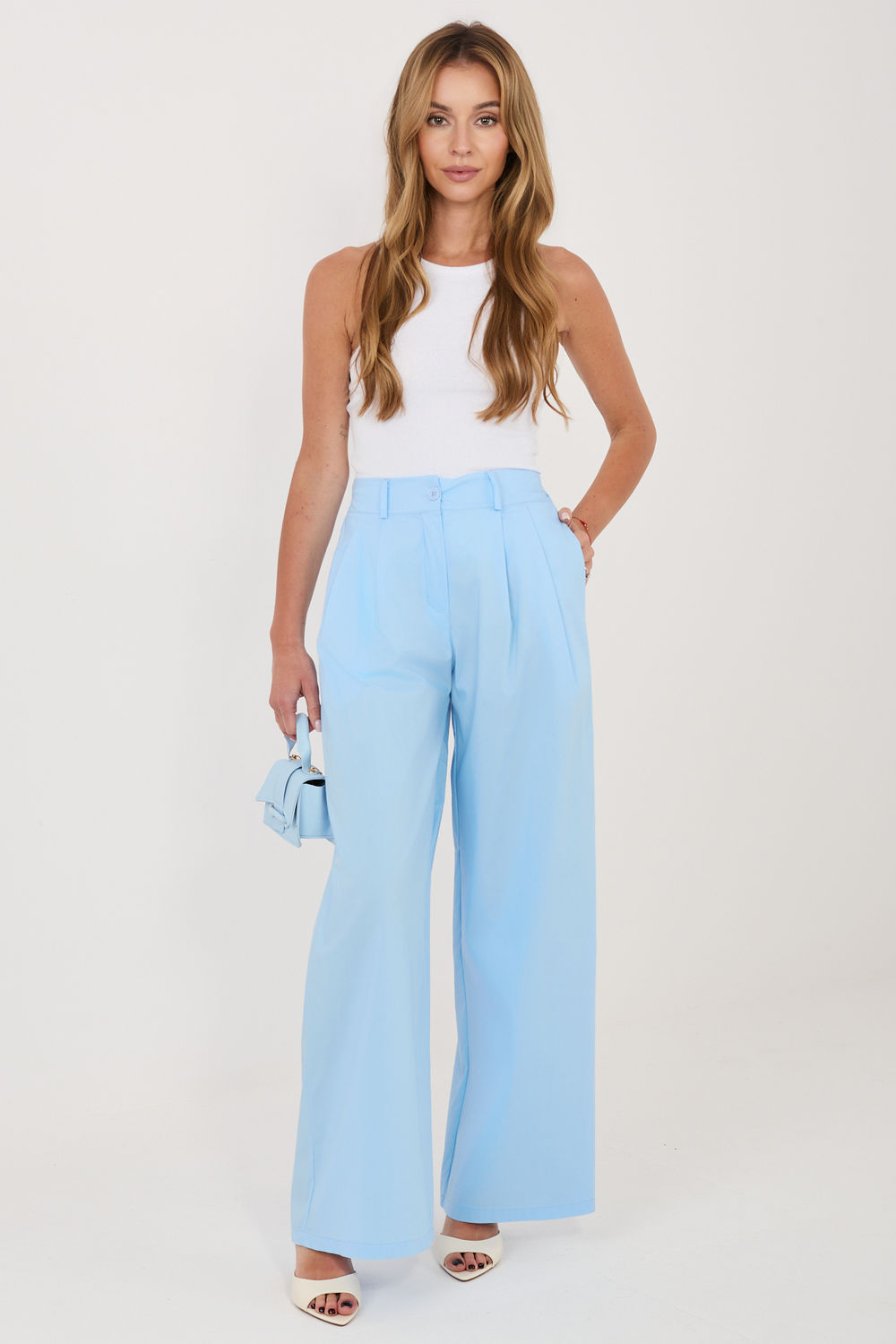 Green pleated trousers