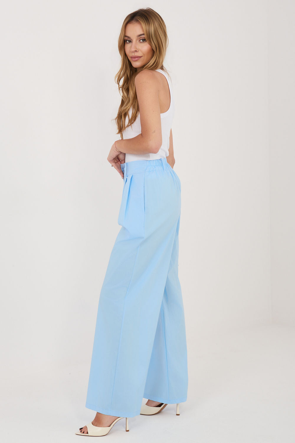 Green pleated trousers