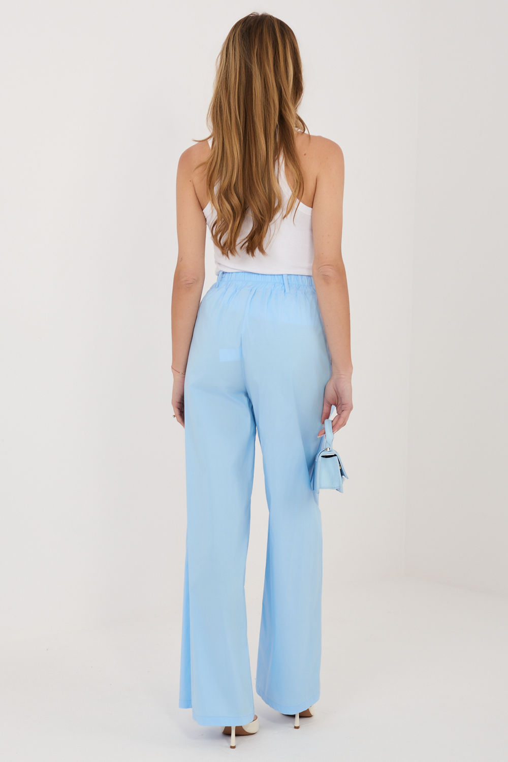 Green pleated trousers