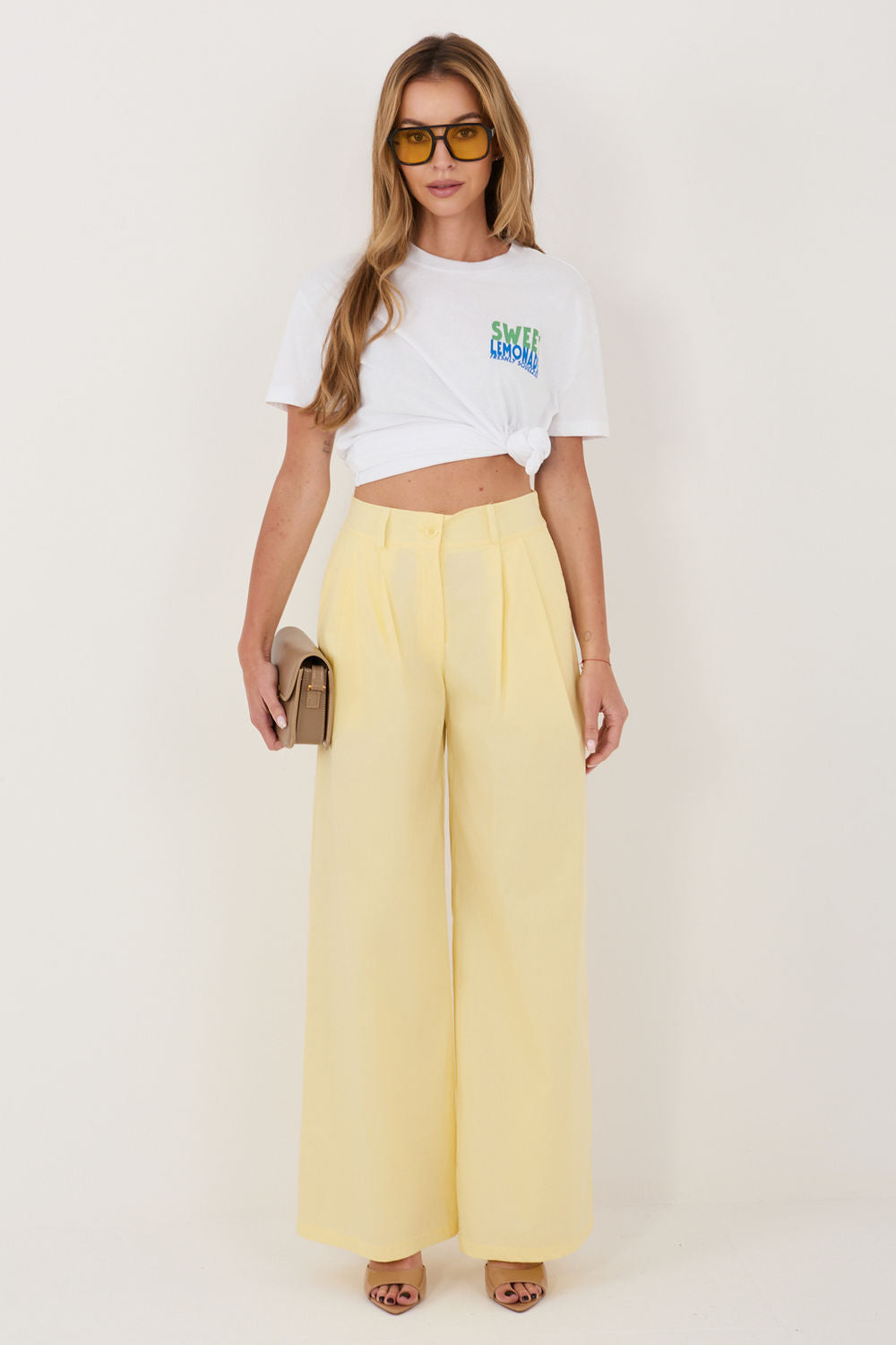 Green pleated trousers