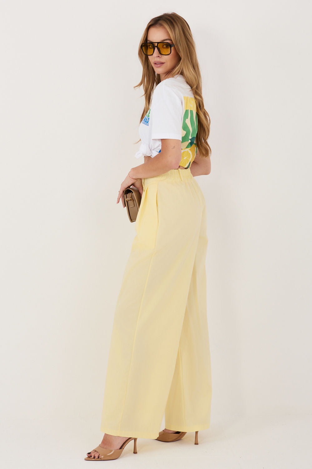 Green pleated trousers