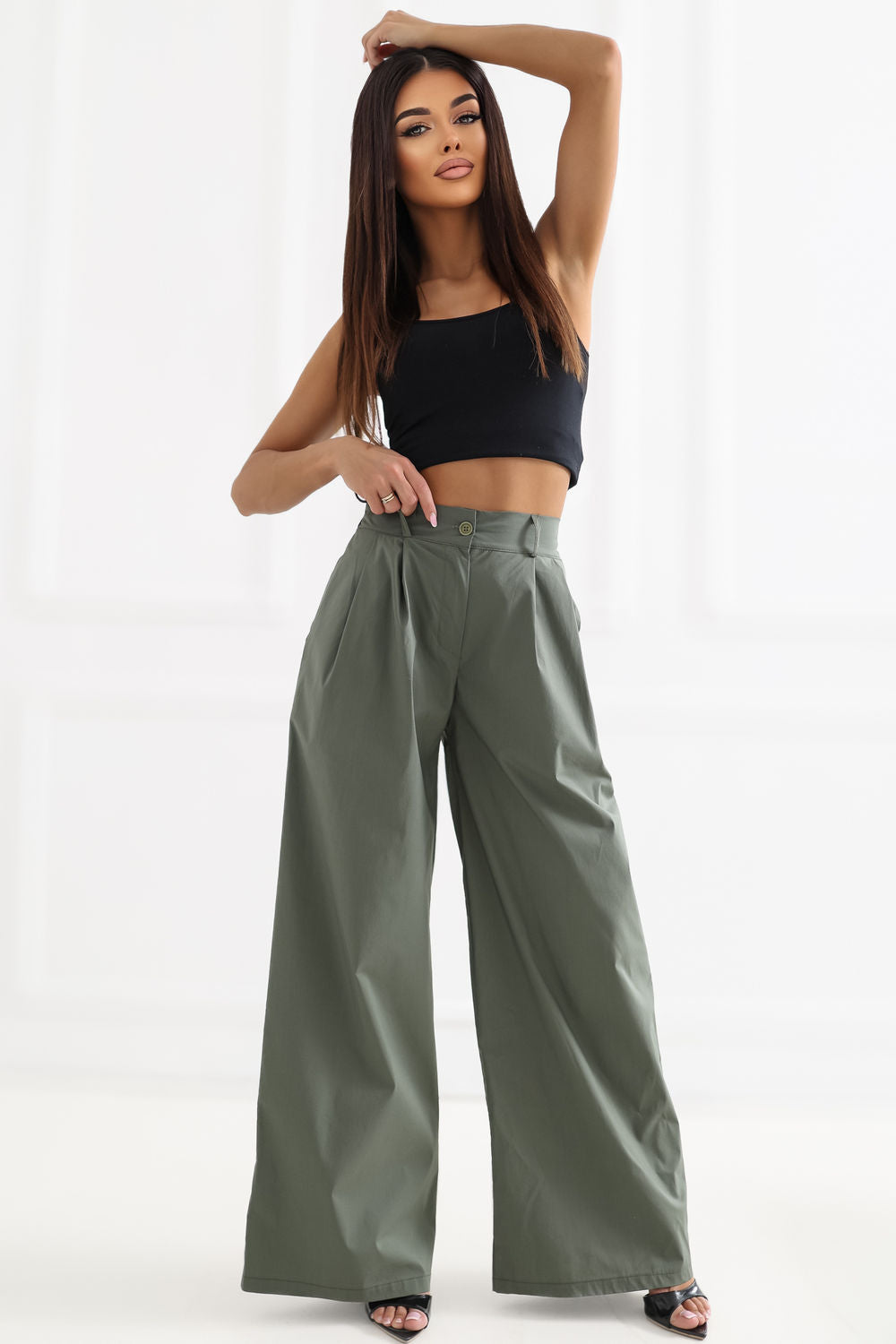 Green pleated trousers