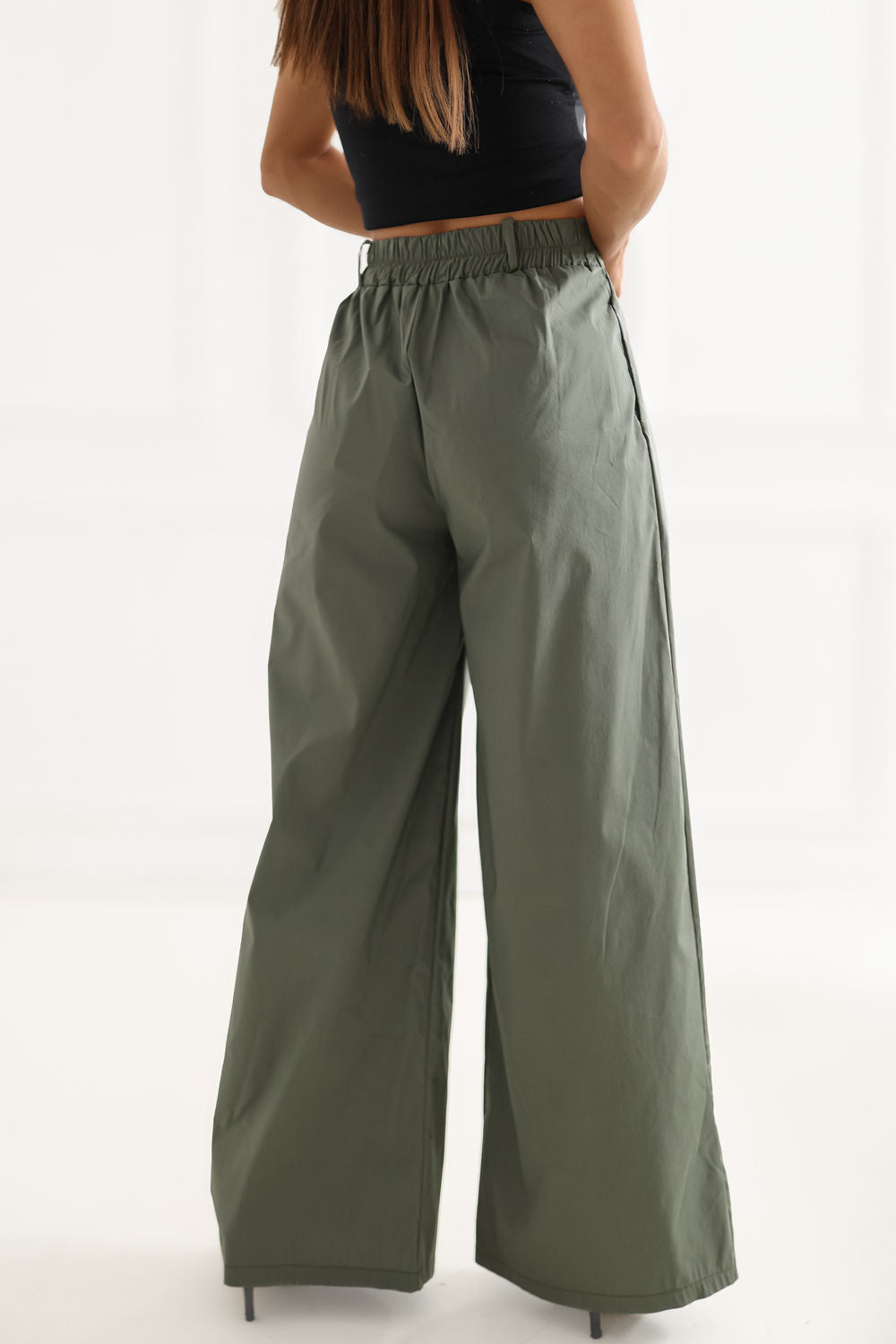 Green pleated trousers
