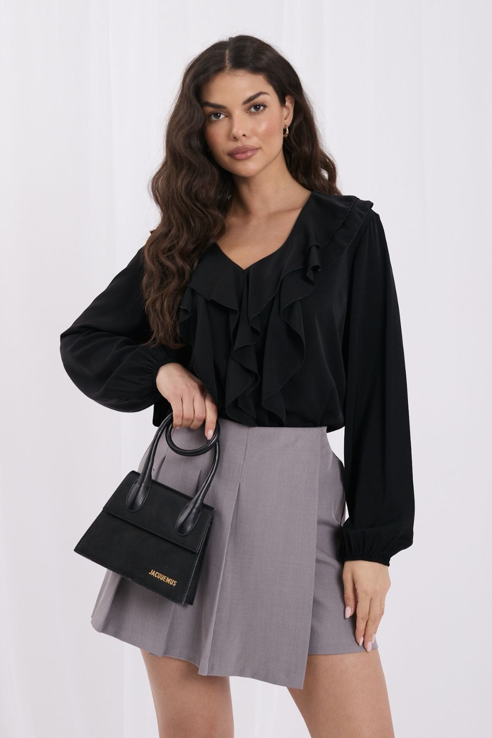 Black ruffled blouse